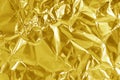 Gold foil leaf shiny texture, abstract yellow wrapping paper for background and design art work Royalty Free Stock Photo