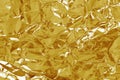 Gold foil leaf shiny texture, abstract yellow wrapping paper for background and design art work Royalty Free Stock Photo