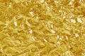 Gold foil leaf shiny texture, abstract yellow wrapping paper for background and design art work Royalty Free Stock Photo