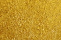Gold foil leaf shiny texture, abstract yellow wrapping paper for background and design art work Royalty Free Stock Photo
