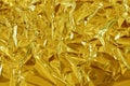 Gold foil leaf shiny texture, abstract yellow wrapping paper for background and design art work Royalty Free Stock Photo