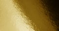 Gold foil texture background with uneven surface Royalty Free Stock Photo