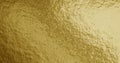 Gold foil texture background with uneven surface Royalty Free Stock Photo
