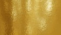 Gold foil texture background with uneven surface Royalty Free Stock Photo