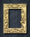 Gold frame on black slate background Royalty Free Stock Photo