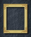 Gold frame on black slate background Royalty Free Stock Photo