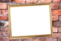 Gold frame on Brick Background of stone. Royalty Free Stock Photo