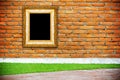 Gold frame on brick wall background Royalty Free Stock Photo