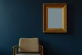 gold frame on a dark blue wall, midcentury armchair below