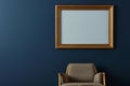 gold frame on a dark blue wall, midcentury armchair below