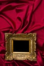 Gold Frame On Red Satin Royalty Free Stock Photo