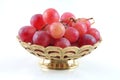 Gold fruit dish with red grape Royalty Free Stock Photo
