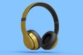 Gold gaming headphones and concept of music equipment isolated on blue .