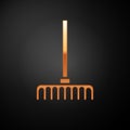 Gold Garden rake icon isolated on black background. Tool for horticulture, agriculture, farming. Ground cultivator