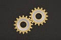 Gold gears on black background. 3D illustration. Royalty Free Stock Photo