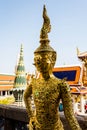 Gold giant statue at the Grand Palace temple of the Emerald Buddha in Bangkok Thailand