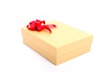 Gold gift box with red bow isolated on white Royalty Free Stock Photo