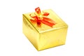 A gold gift box with red ribbon bow on white background, Merry C Royalty Free Stock Photo