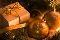 Gold gift box with silver bow, toy balls Royalty Free Stock Photo