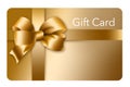 A gold gift card with a gold bow and ribbon is pictured here isolated on the background Royalty Free Stock Photo