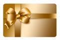 A gold gift card with a gold bow and ribbon is pictured here isolated on the background Royalty Free Stock Photo