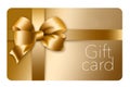 A gold gift card with a gold bow and ribbon is pictured here isolated on the background Royalty Free Stock Photo