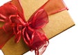 Gold gift with red bow isolated Royalty Free Stock Photo