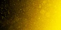 Gold glitter background with bright sparkling circles or blurred bokeh lights on black background, yellow abstract pattern of shim Royalty Free Stock Photo