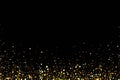 Gold glitter background with shiny light confetti on black background. Golden shimmery texture for luxury background
