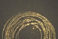 Gold glitter on black background for your design, round frame, place for text Royalty Free Stock Photo