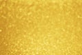 Gold glitter blurred background. Golden sparkle bokeh lights. Festive holiday backdrop Royalty Free Stock Photo