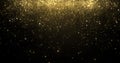 Gold glitter confetti particles falling, golden sparkling light shine background for Christmas holiday. Abstract magic golden