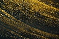 Gold glitter on dark green bokeh abstract light defocused background. Royalty Free Stock Photo