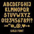 Gold glitter english alphabet, punctuation marks and numbers. Royalty Free Stock Photo