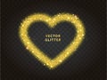Gold glitter heart frame with sparkles on black background. Valentine\'s Day Royalty Free Stock Photo
