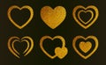 Gold glitter hearts set. Vector romantic shiny icons with sparkles for valentine\'s day isolated on black background Royalty Free Stock Photo