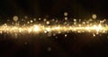 Gold glitter, light particles shine bokeh effect, shimmering magic bright glare. Shining gold glitter sparks and glittering