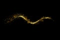 Gold glitter particles lights trail and bokeh on a black background. Abstract line sparkle texture Royalty Free Stock Photo