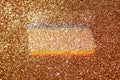 Gold glitter sparkle background with shimmer bokeh and subtle rainbow reflection Royalty Free Stock Photo