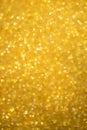 Gold glitter sparkles with bokeh effect. Festive background with bright golden lights. Christmas mood concept. Copy space texture Royalty Free Stock Photo