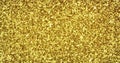 Gold glitter sparkling light shine background with golden particles texture. Shimmering sparkles and golden glowing shimmer Royalty Free Stock Photo