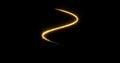 Gold glitter spiral with glittering light shine sparkles on black background for Christmas holiday. Abstract magic glow of