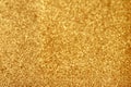 Gold glitter texture sparkling paper background. Abstract twinkled golden glittering background with bokeh, defocused lights for Royalty Free Stock Photo