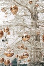 Gold glossy Christmas balls on a white glass Christmas tree. Royalty Free Stock Photo