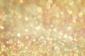 Gold Glow glitter background. Elegant abstract background with bokeh Royalty Free Stock Photo
