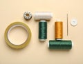 Gold and Green Thread with Needle and Buttons Royalty Free Stock Photo