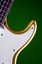Gold Guitar Isolated on Green Royalty Free Stock Photo