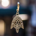 A gold hamsa charm with a diamond in the center, AI Royalty Free Stock Photo