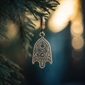 A gold hamsa pendant hanging from a tree branch, AI