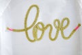 The gold hand craft text Love typo knitting on the white textile